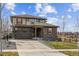 Charming two-story home featuring a two-car garage and a well-maintained front yard at 7301 S Shady Grove Way, Aurora, CO 80016