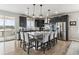 Spacious kitchen with stainless steel appliances, granite countertops, and a center island with seating at 7301 S Shady Grove Way, Aurora, CO 80016
