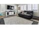 Comfortable living room with hardwood floors, a large window with shutters, and stylish decor at 7301 S Shady Grove Way, Aurora, CO 80016