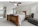 Comfortable main bedroom with neutral tones, a wooden bed frame, and a ceiling fan at 7301 S Shady Grove Way, Aurora, CO 80016