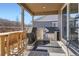 Covered back patio with grill and bar seating, perfect for outdoor entertaining at 7258 Oasis Dr, Castle Rock, CO 80108