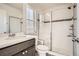 Updated bathroom featuring a tiled walk-in shower with glass door and a modern vanity at 7258 Oasis Dr, Castle Rock, CO 80108