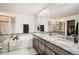 Modern bathroom featuring a soaking tub, glass-enclosed shower, and granite countertops at 7258 Oasis Dr, Castle Rock, CO 80108
