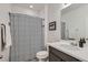 Bathroom features a shower with stylish curtain, toilet, and vanity with basin sink at 7258 Oasis Dr, Castle Rock, CO 80108