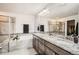 Beautiful bathroom with a soaking tub, a walk-in shower, and a granite vanity with dual sinks and ample counterspace at 7258 Oasis Dr, Castle Rock, CO 80108