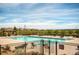 Community pool area with a swimming pool, tables, and lounge chairs; great for relaxation at 7258 Oasis Dr, Castle Rock, CO 80108