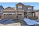 Charming two-story home showcasing a three-car garage and inviting front porch at 7258 Oasis Dr, Castle Rock, CO 80108