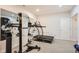 A home gym features a mirror, treadmill, and a variety of exercise equipment at 7258 Oasis Dr, Castle Rock, CO 80108