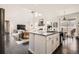 Modern kitchen with granite countertops, stainless steel appliances, a center island, and an open view to the living area at 7258 Oasis Dr, Castle Rock, CO 80108