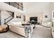 Bright living room with soaring ceilings, fireplace, and staircase to the second floor at 7258 Oasis Dr, Castle Rock, CO 80108