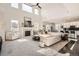Bright and airy living room with high ceilings, a fireplace, large windows, and an open concept design at 7258 Oasis Dr, Castle Rock, CO 80108