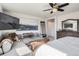 Spacious main bedroom featuring a comfortable seating area, soft lighting, and ample closet space at 7258 Oasis Dr, Castle Rock, CO 80108