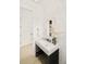 Elegant powder room featuring stylish fixtures, sleek mirror, patterned tile, and contemporary design at 2773 S Garfield St, Denver, CO 80210
