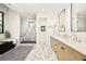 Luxurious bathroom featuring a marble shower, a soaking tub, and a stylish double vanity at 2773 S Garfield St, Denver, CO 80210