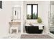 Bathroom features a black soaking tub, vanity area, large window and white tile at 2773 S Garfield St, Denver, CO 80210