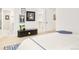 Bedroom area includes an ottoman, pictures on the wall, and access to a walk-in closet at 2773 S Garfield St, Denver, CO 80210