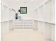 Spacious walk-in closet with ample shelving and a natural light from a window at 2773 S Garfield St, Denver, CO 80210
