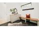 Chic entryway with a built-in bench, decorative mirror, modern storage, and stylish accents at 2773 S Garfield St, Denver, CO 80210