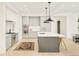 Well-equipped kitchen with stainless steel appliances, central island, and gray cabinetry at 2773 S Garfield St, Denver, CO 80210