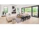 Bright living room showcases a modern fireplace and floor-to-ceiling windows, enhancing the space at 2773 S Garfield St, Denver, CO 80210