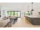 Spacious open-concept kitchen and living room features hardwood floors and ample natural light at 2773 S Garfield St, Denver, CO 80210