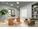 Modern office boasts built-in shelving, hardwood floors, modern decor, and a picture window at 2773 S Garfield St, Denver, CO 80210
