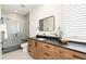 Modern bathroom with a walk-in shower and stylish vanity at 2599 Heron Lakes Pkwy, Berthoud, CO 80513