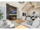 Elegant living room featuring a fireplace and open concept design at 2599 Heron Lakes Pkwy, Berthoud, CO 80513