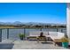 Enjoy mountain views from this patio overlooking a lake at 2599 Heron Lakes Pkwy, Berthoud, CO 80513