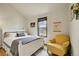 Bright bedroom with neutral decor, comfortable bedding, and lots of natural light at 7614 Malamute Dr, Evergreen, CO 80439