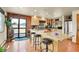 Gourmet kitchen with granite countertops, stainless steel appliances, and breakfast bar seating at 7614 Malamute Dr, Evergreen, CO 80439