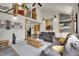 Inviting living room featuring a spiral staircase and vaulted ceilings perfect for relaxing and entertaining at 7614 Malamute Dr, Evergreen, CO 80439