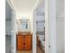 Cozy bathroom featuring a wooden vanity with a tiled countertop and a toilet in an adjacent small space at 1020 15Th St # 13K, Denver, CO 80202