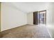 Spacious carpeted bedroom featuring neutral walls and a sliding glass door leading to a balcony at 1020 15Th St # 13K, Denver, CO 80202