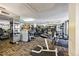 Bright gym includes an array of machines and weights for residents with mirrored walls and city view at 1020 15Th St # 13K, Denver, CO 80202