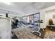 Well-equipped gym featuring modern exercise machines and weights, set against city views through large windows at 1020 15Th St # 13K, Denver, CO 80202