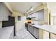 Updated kitchen featuring stainless steel appliances, stylish gray cabinets, and modern countertops at 1020 15Th St # 13K, Denver, CO 80202