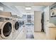 A bright, spacious laundry room featuring several washing machines and dryers at 1020 15Th St # 13K, Denver, CO 80202