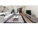 Cozy living room with updated furnishings, decor, and neutral color scheme at 1020 15Th St # 13K, Denver, CO 80202