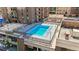 Aerial view of a rooftop pool with city views and lounge seating at 1020 15Th St # 13K, Denver, CO 80202