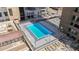 Rooftop pool surrounded by lounge chairs with city views at 1020 15Th St # 13K, Denver, CO 80202