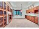 Finished basement featuring a kitchenette, a fireplace, and a pendant light at 16710 Vincent Ave, Monument, CO 80132