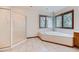 Bright bathroom featuring a soaking tub, a shower, and an attractive tile floor at 16710 Vincent Ave, Monument, CO 80132