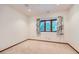 Well lit bedroom featuring neutral carpet and a window bringing in natural light at 16710 Vincent Ave, Monument, CO 80132