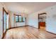 Bright dining room featuring hardwood floors, a chandelier, a doorway, and ample space for entertaining guests at 16710 Vincent Ave, Monument, CO 80132
