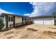 Ranch-style home featuring a ramp leading to the front door and an oversized garage with a large concrete driveway at 16710 Vincent Ave, Monument, CO 80132
