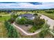 An elevated exterior view highlights landscaping and architectural details like modern lines, neutral tones, and oversized windows at 16710 Vincent Ave, Monument, CO 80132