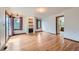 Bright living room featuring hardwood floors, a fireplace, and natural light from a sliding glass door at 16710 Vincent Ave, Monument, CO 80132