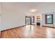 Bright living room featuring hardwood floors, a fireplace, and natural light from a sliding glass door at 16710 Vincent Ave, Monument, CO 80132