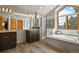 Gorgeous bathroom features double vanity, shower, and soaking tub with scenic views at 386 Monte Vista Rd, Golden, CO 80401
